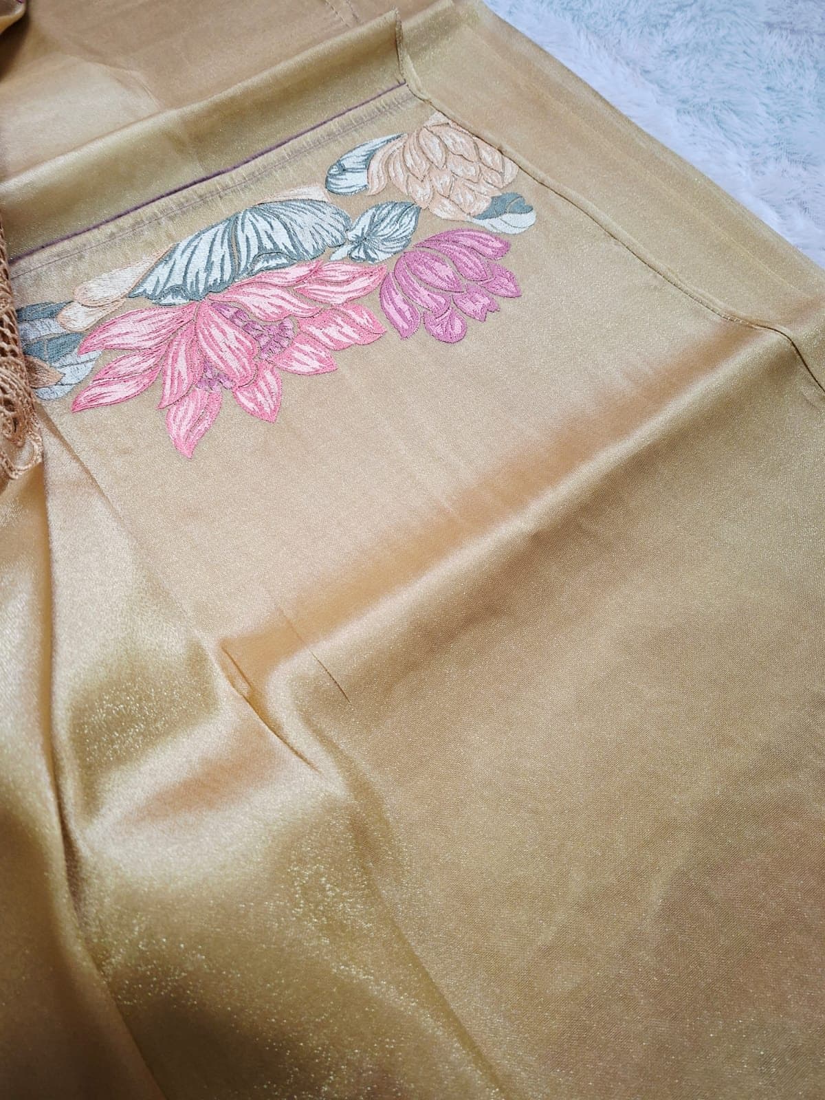 Lotus embroidery on a gold pure tissue saree